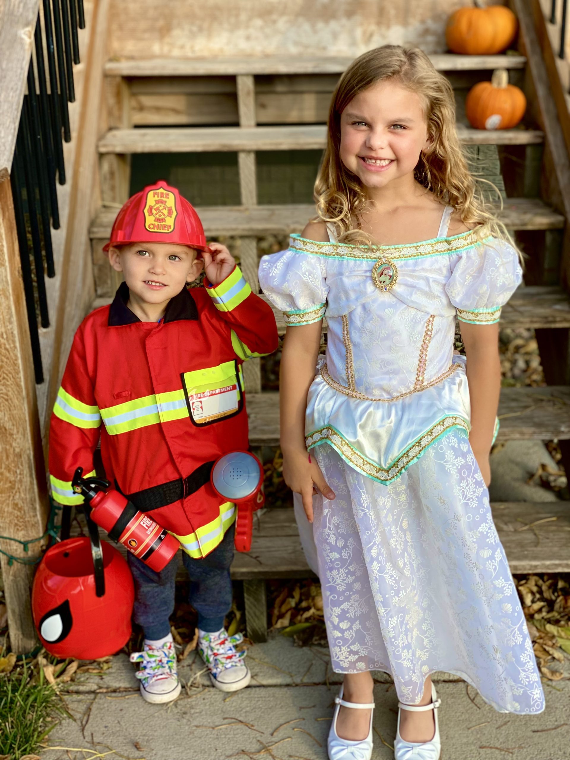 Two beautiful kids happily wearing their costume