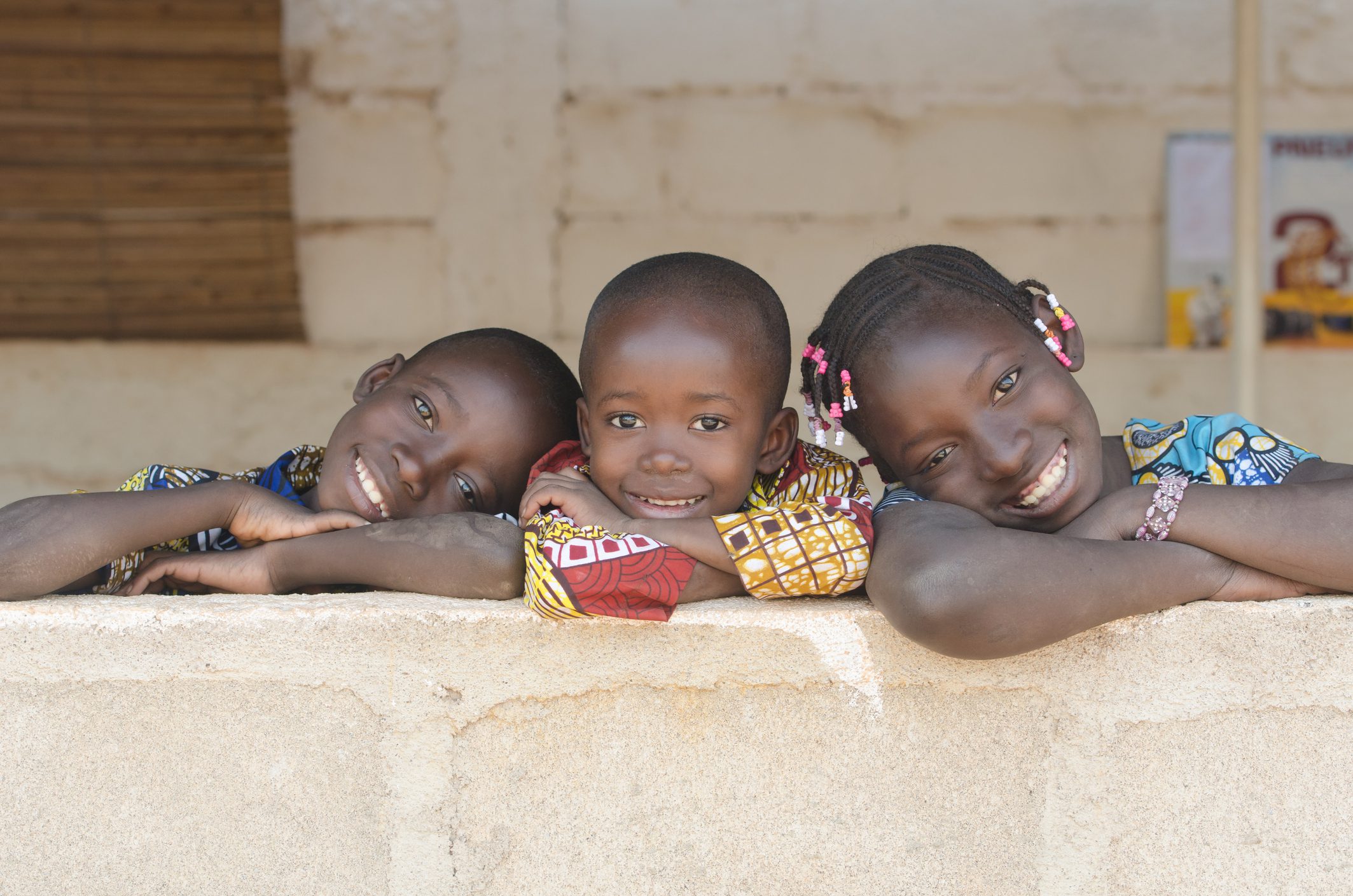 Three Adorable African Children Posing Outdoors
